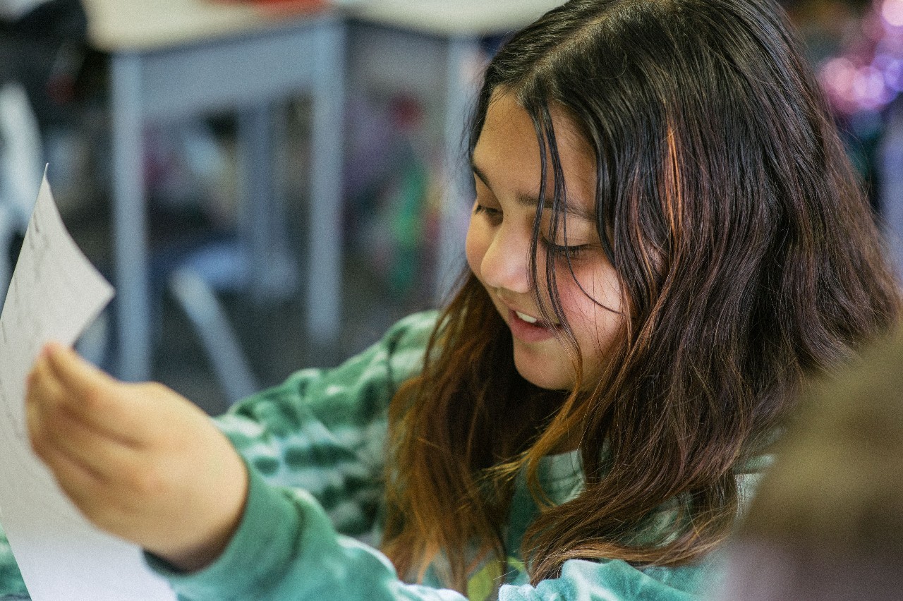 An AEES student studies in class.